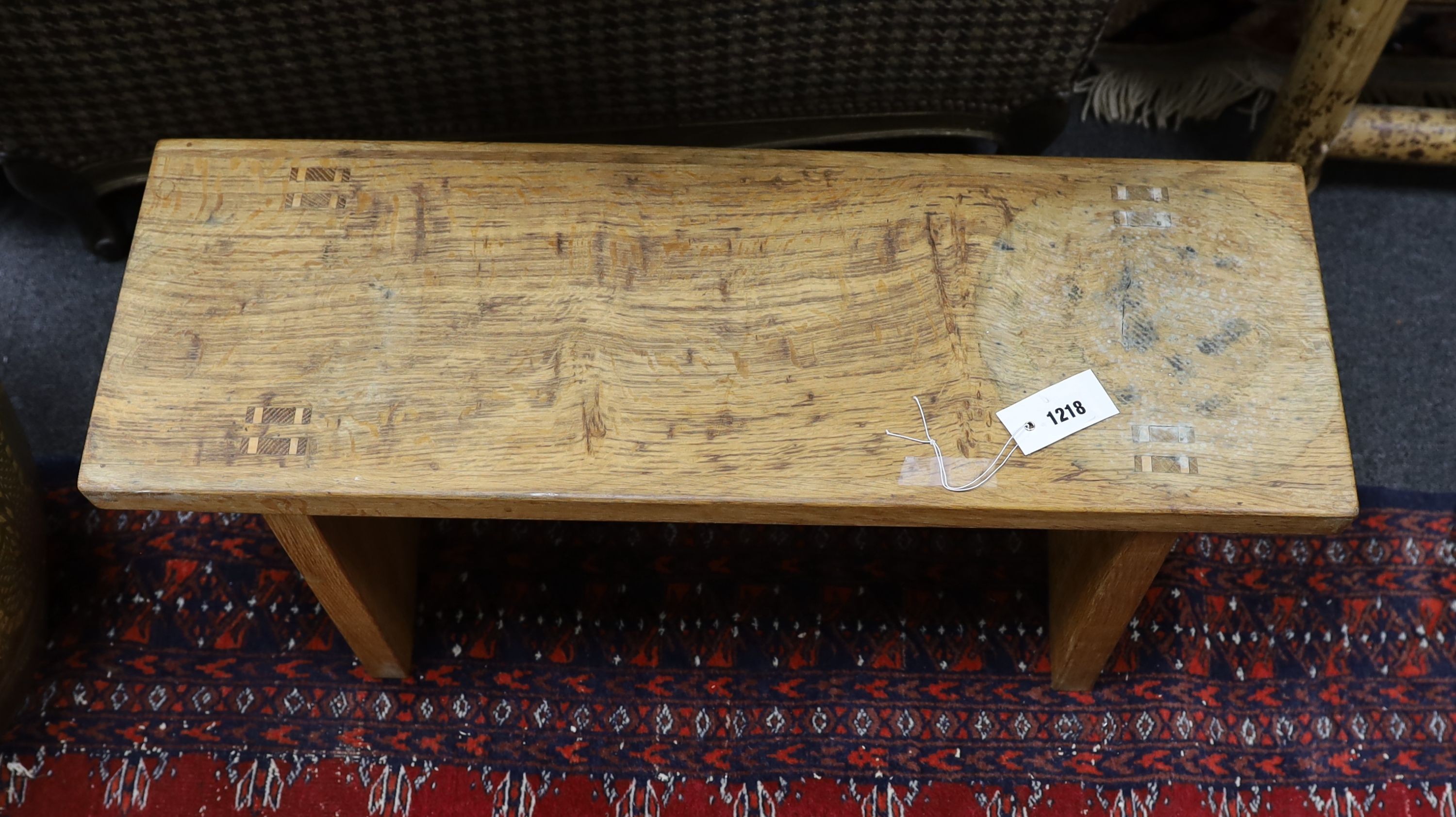 A Cotswold style small oak bench stamped 'W H Pinner', width 78cm, depth 27cm, height 34cm